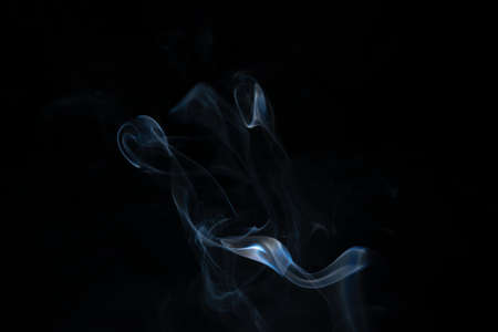 White smoke in a black backgroundの写真素材