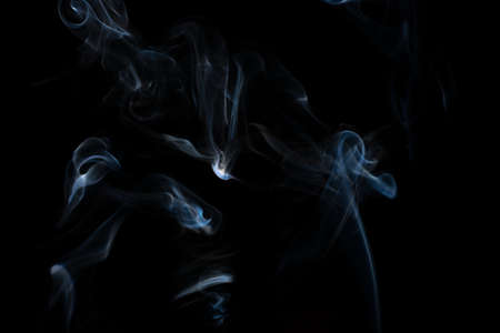 White smoke in a black backgroundの写真素材