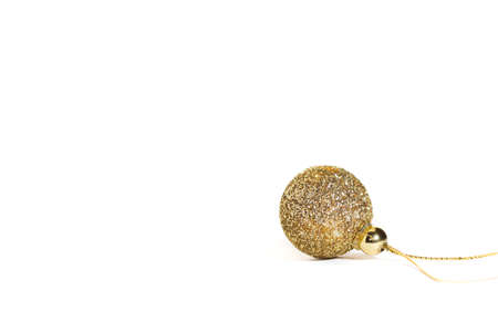 Golden Christmas ball, white backgroundの写真素材