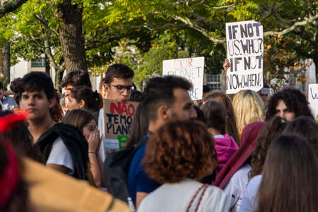 People with placards and posters on global strike for climate change. Porto, Portugalのeditorial素材