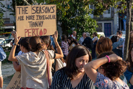 People with placards and posters on global strike for climate change. Porto, Portugalのeditorial素材