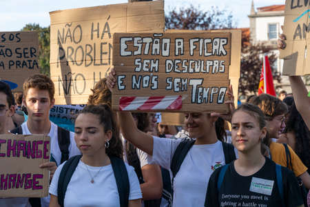 People with placards and posters on global strike for climate change. Porto, Portugalのeditorial素材