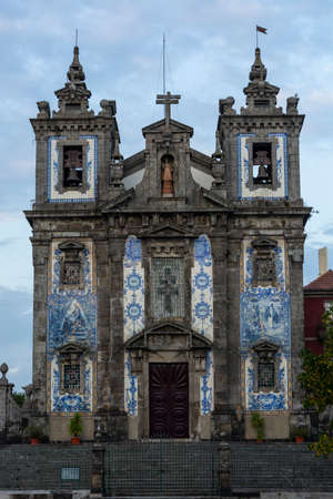 Santo Ildefonso church. Blue relegious tiles. Cloudy sky. Porto, Portugalのeditorial素材