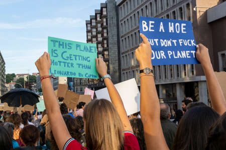 People with placards and posters on global strike for climate change. Porto, Portugalの写真素材