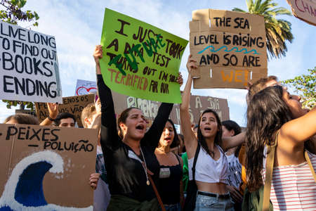 People with placards and posters on global strike for climate change. Porto, Portugalのeditorial素材