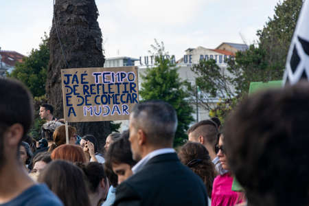 People with placards and posters on global strike for climate change. Porto, Portugalのeditorial素材