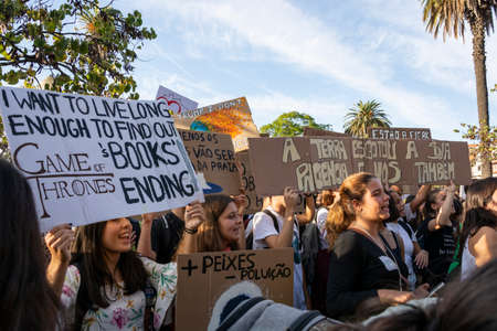 People with placards and posters on global strike for climate change. Porto, Portugalのeditorial素材