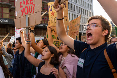 People with placards and posters on global strike for climate change. Porto, Portugalのeditorial素材