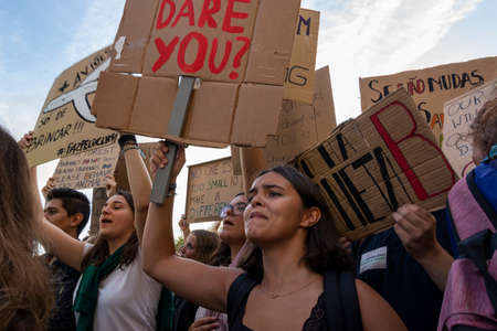 People with placards and posters on global strike for climate change. Porto, Portugalのeditorial素材
