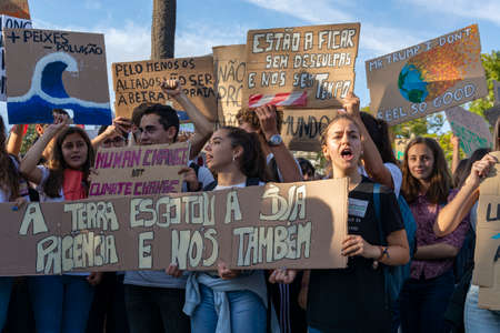 People with placards and posters on global strike for climate change. Porto, Portugalのeditorial素材
