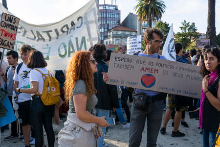 People with placards and posters on global strike for climate change. Porto, Portugalのeditorial素材