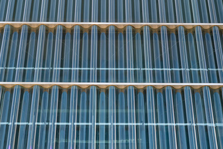 Corrugated glass. Wavy pattern of bluish color. Casa da Musica do Porto (Porto Music House), Portugal. Abstract image.の写真素材