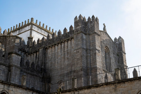 Porto cathedral seen from the inner courtyard. Building made of stone Blue sky. Porto, Portugal.の写真素材