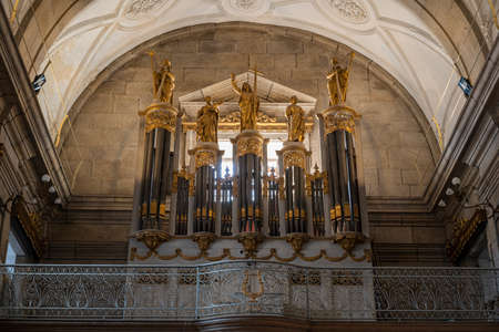 Gold saint statues on top of a church organ. Interior of the Igreja Paroquial de Nossa Senhora da VitÃ³ria (Parish Church of Nossa Senhora da VitÃ³ria). Porto, Portugal.のeditorial素材