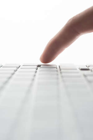 Finger tap the Enter key of a keyboard