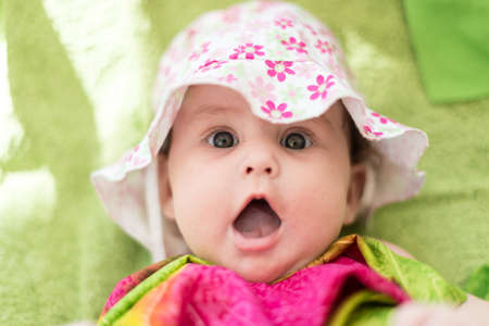 Baby expressive portrait with hat.の写真素材