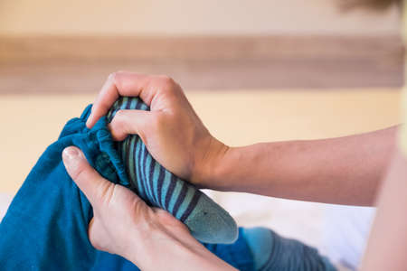 foot massage kid therapist healing.の写真素材