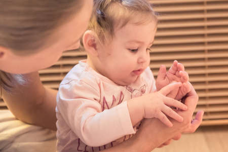 Baby at therapist physio healing massage.