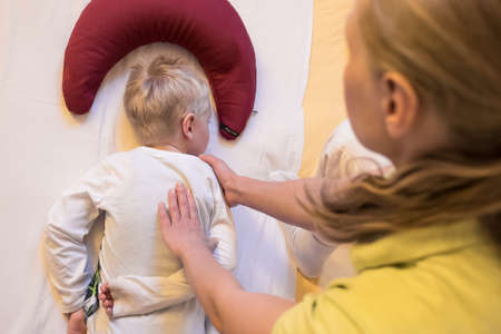 shiatsu back massage therapist kid.の写真素材