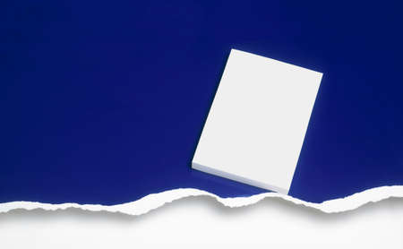 Graphic resource. Blank cover book against a ripped blue background.   on cover book.の写真素材