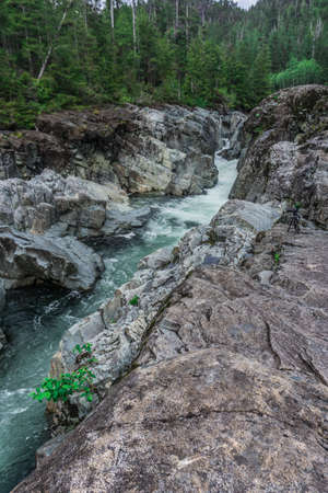The beauty of Wally Creek pullout. Forest, wild river, rocks and trees on Vancouver Island in Canadaの写真素材
