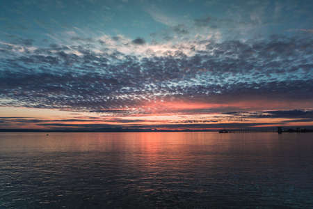 Colorful sunset over the ocean in Vancouver Canada from the ferry.の写真素材