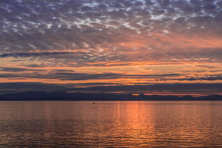 Colorful sunset over the ocean in Vancouver Canada from the ferry.の写真素材