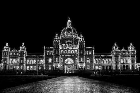 British Columbia Parliament building in majestic Victoria inner harbor Canada during nightのeditorial素材