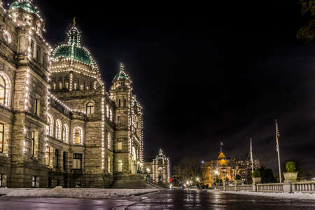 British Columbia Parliament building in majestic Victoria inner harbor Canada during nightのeditorial素材