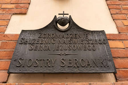 Ornamental metalwork name plate of home of Congregation of Sister Servants of The Most Sacred Hearth...