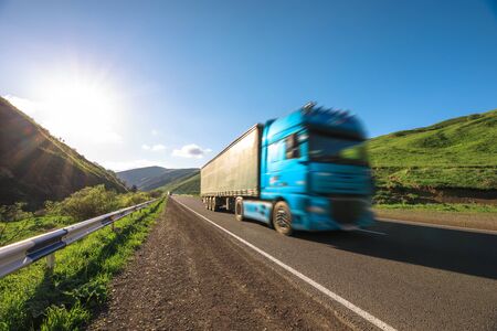 Arriving  blue truck on the road