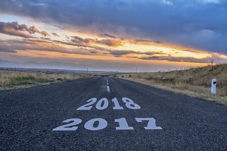 Asphalt road with a year date in it.の写真素材