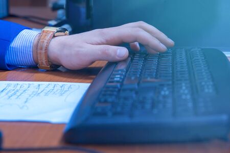 A businessman using laptop in business officeの写真素材
