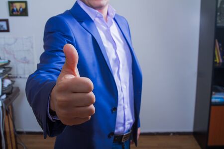 Business man showing thumb up.の写真素材