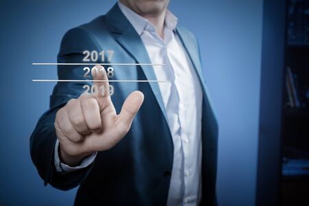 Businessman pointing year 2018の写真素材