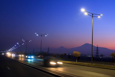Abstract blurred light trails on  highway at nightの写真素材
