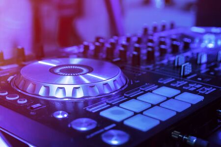 DJ Spinning Mixing and Scratching in a Night Clubの写真素材