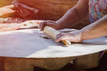 Hands of a woman preparing dough for backing.の写真素材