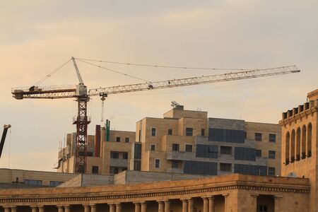 crane and unfinished buildingの写真素材