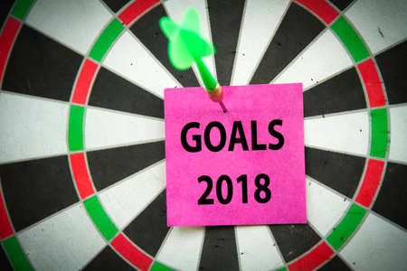 Setting 2018 goals on target with the sticky note and dart