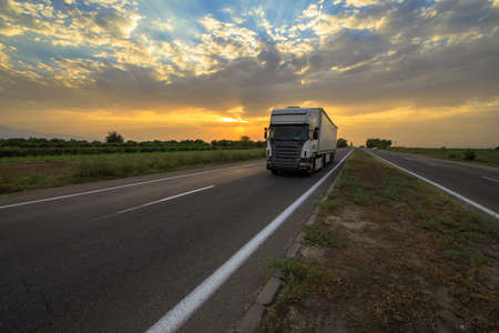 White big truck standing on road.の写真素材