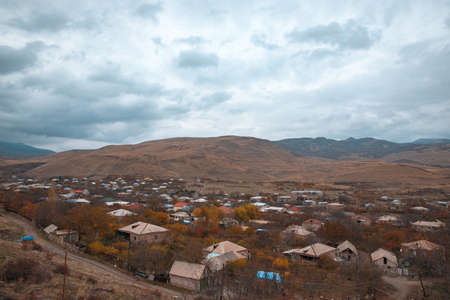 Village and mountain in autumn