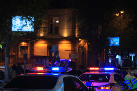 Police car at night in city