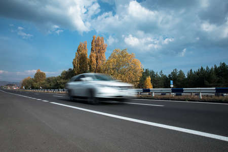 Car in road under blue skyの写真素材
