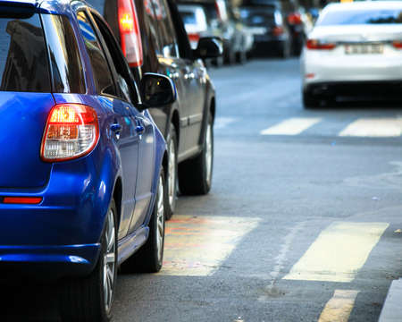 Rear light of blue color modern car on road.の写真素材