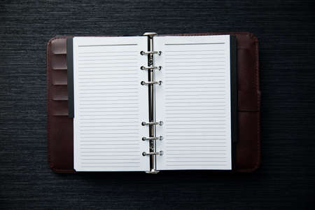 Bible with notepad and pen on tableの写真素材