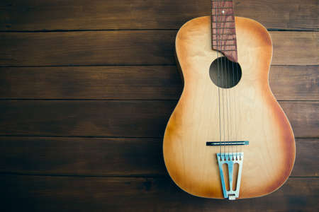 guitar on the wooden table background