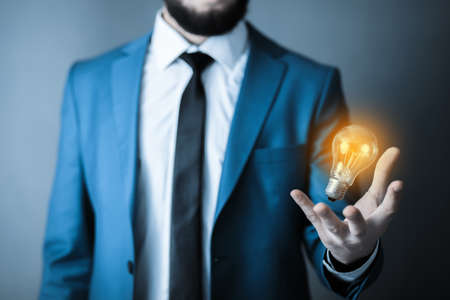 man hand light bulb in screen