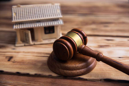 judge with house model on tableの写真素材