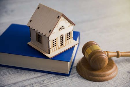 house model on book with judge on tableの写真素材